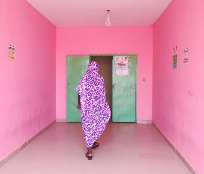 woman walking in a hospital corridor