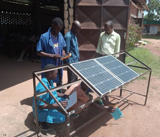 young trainees learning how to build solar panels