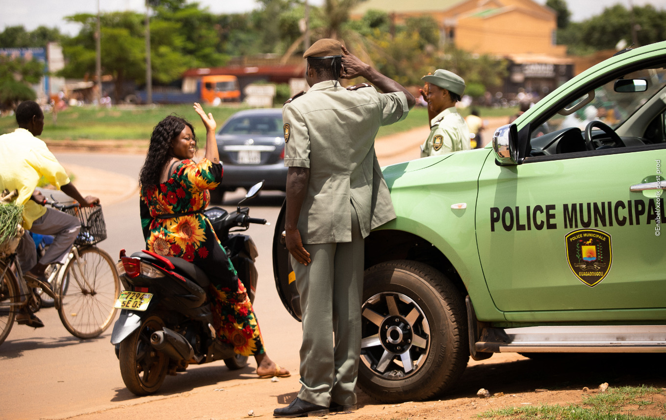 woman saluting a police officer