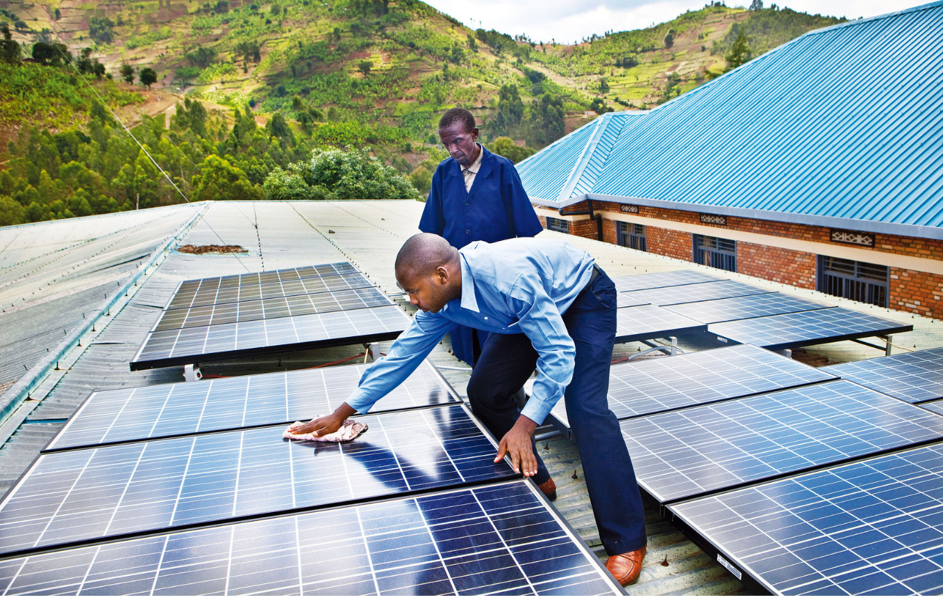 man cleaning a solar panel