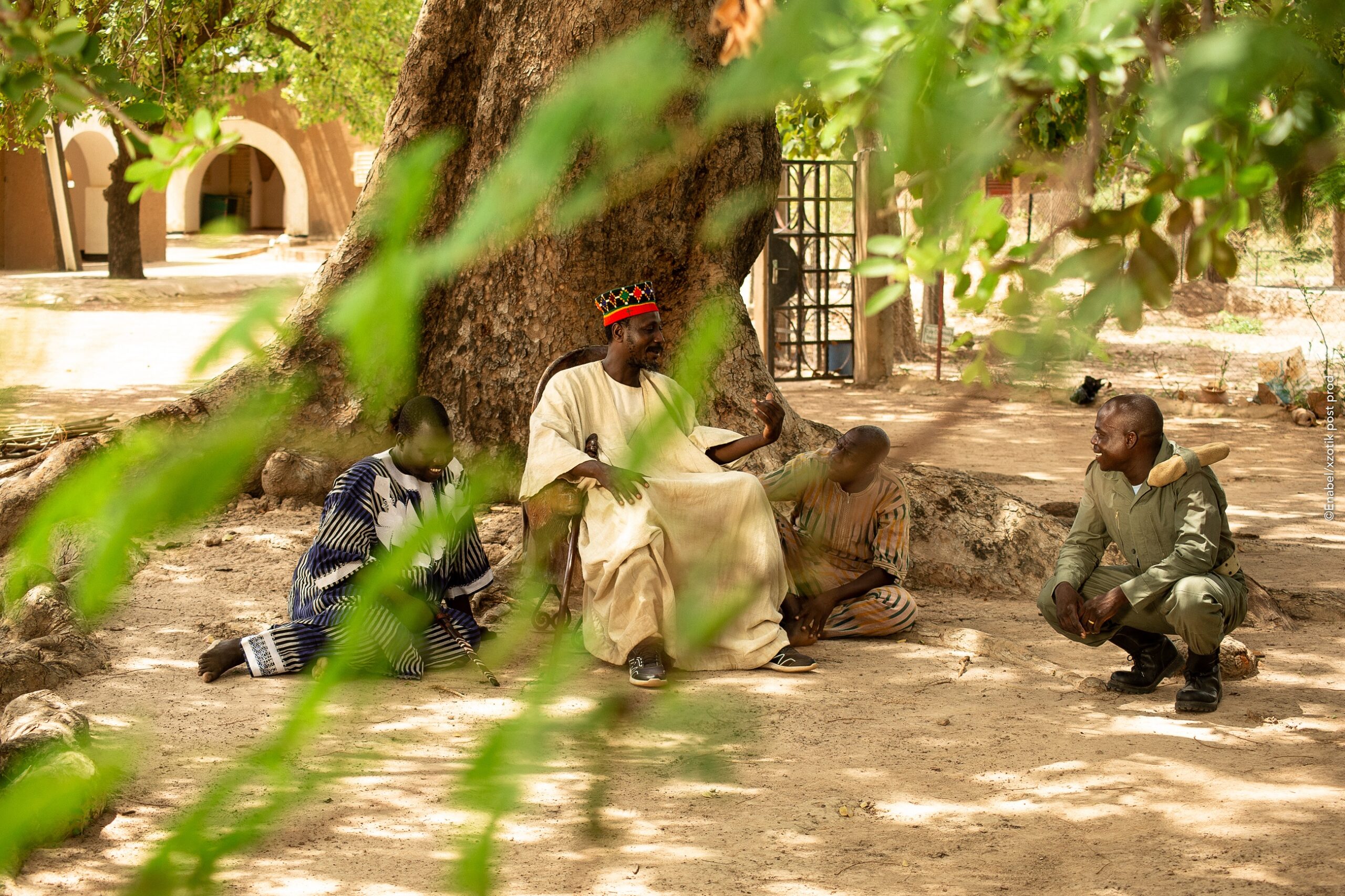 burkinabe policeman talking with a civilian