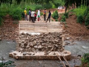 Men constructing a stone arch bridge in Tanzania