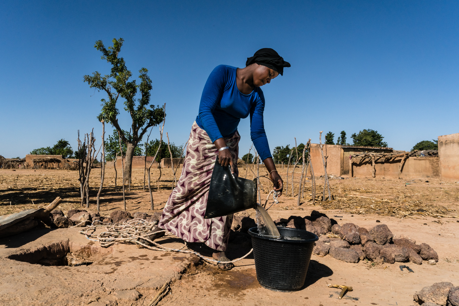 A woman fetches water from a well in Kolokani, a village in Mali.