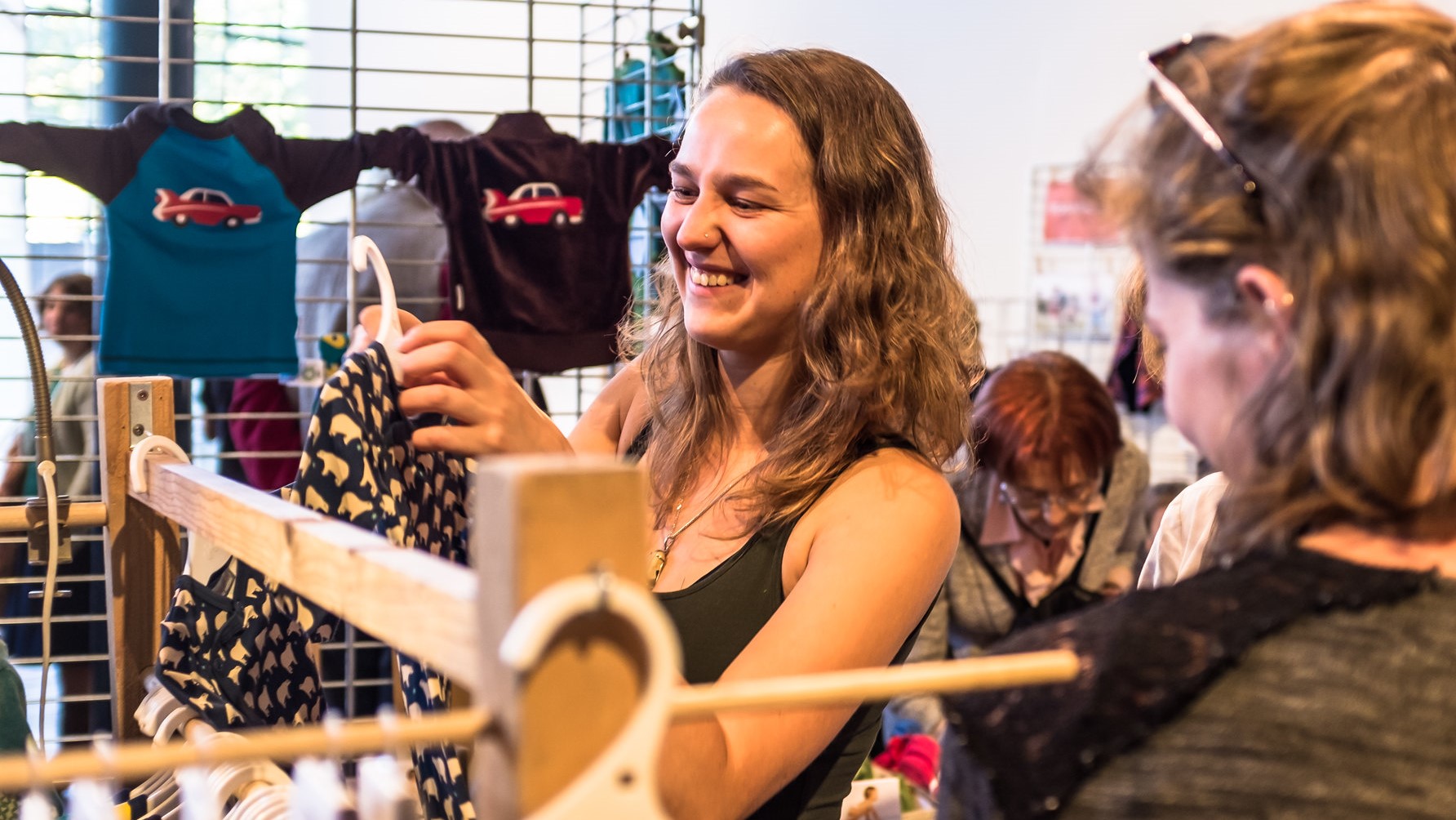 woman smiling at a fair fashion in Gent