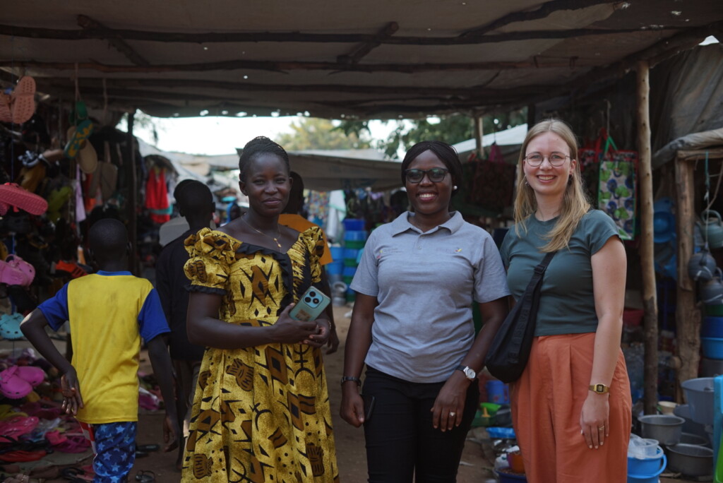 Three women pose for a picture.