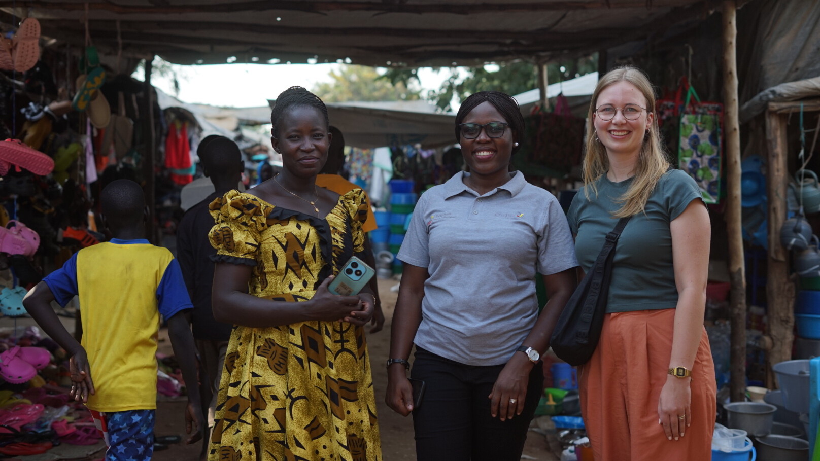 3 women pose for a picture.
