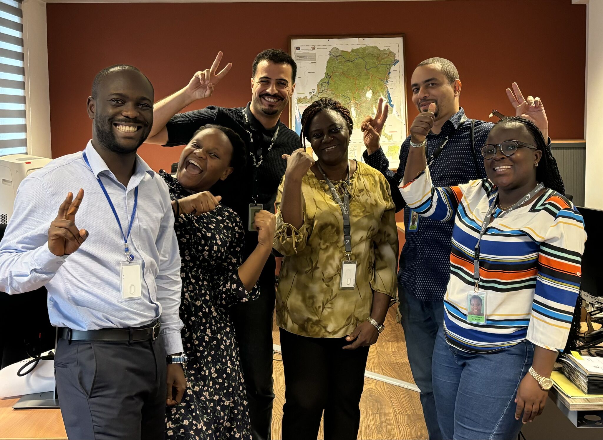 Group op people smiling at camera.