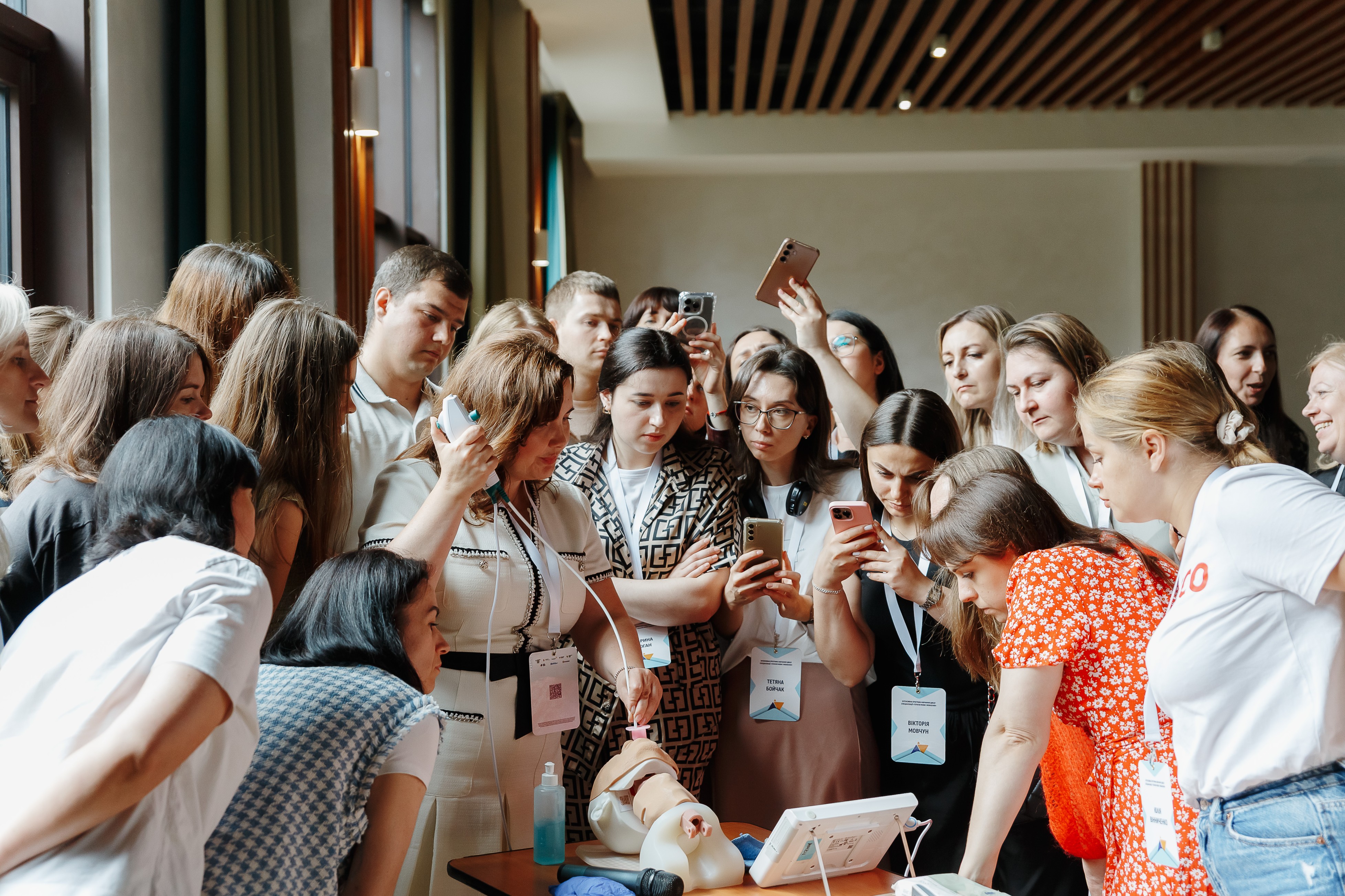 young people with trainer around a table