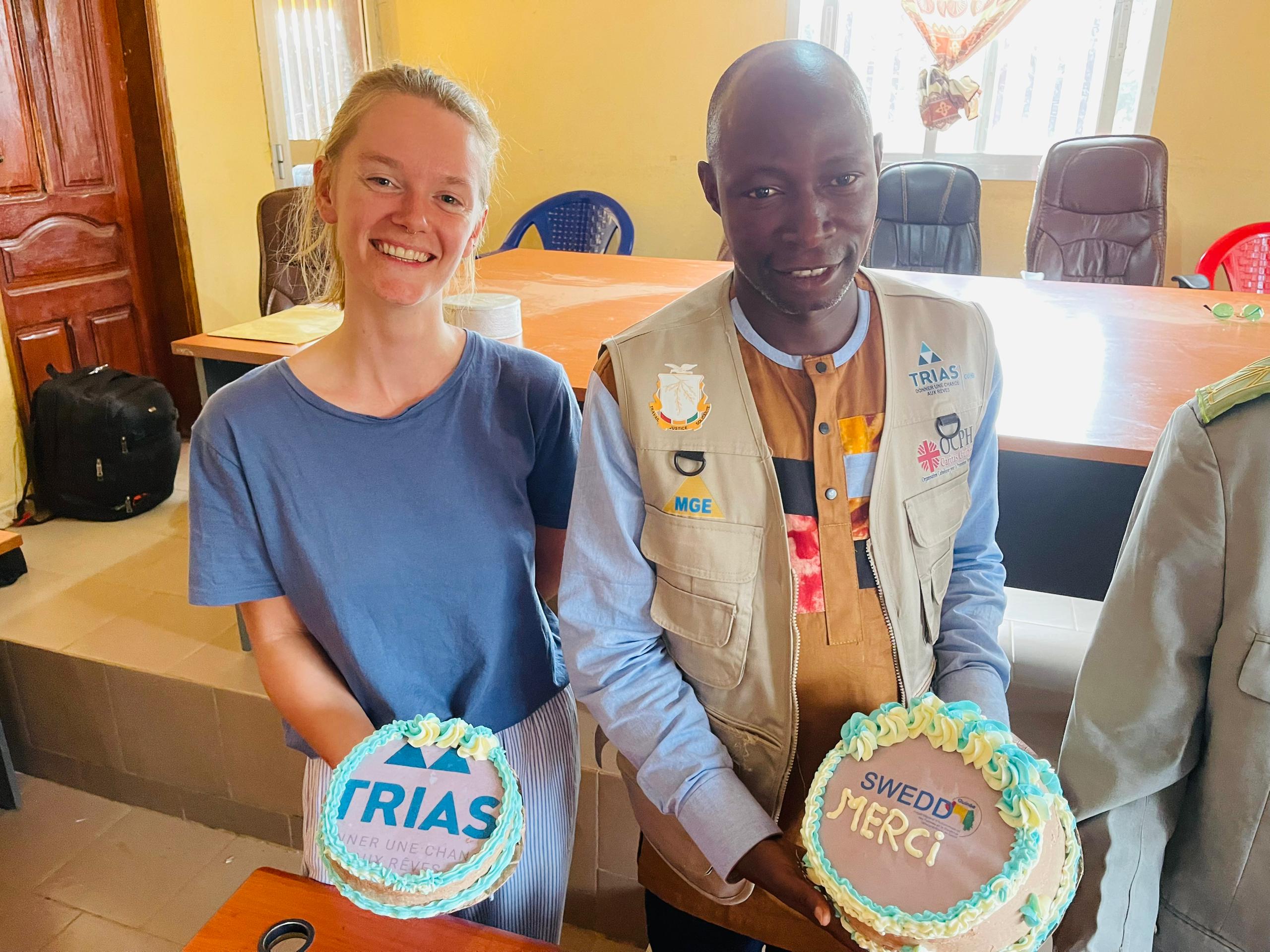 Woman and man smiling.