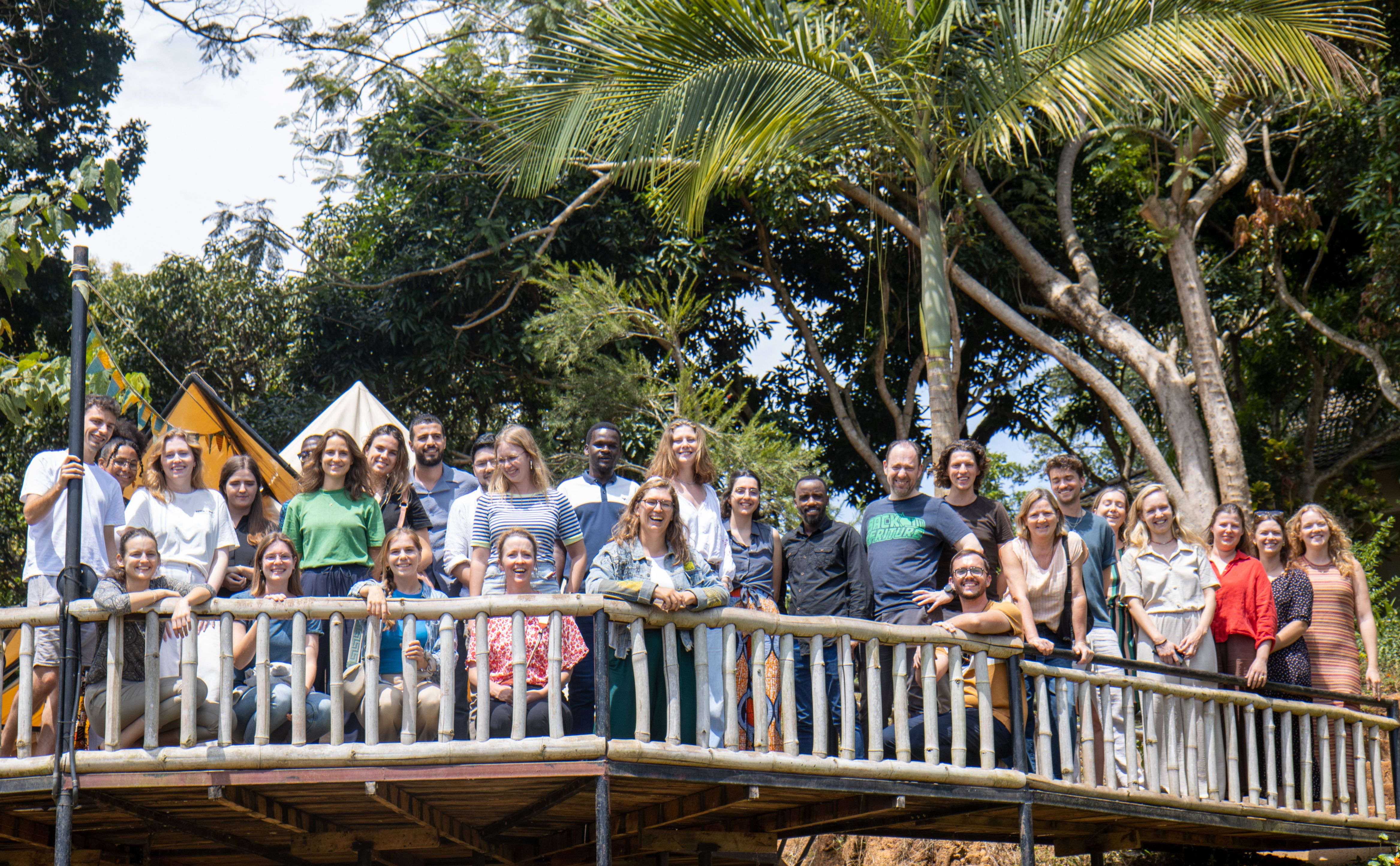 young people standing on a bridge