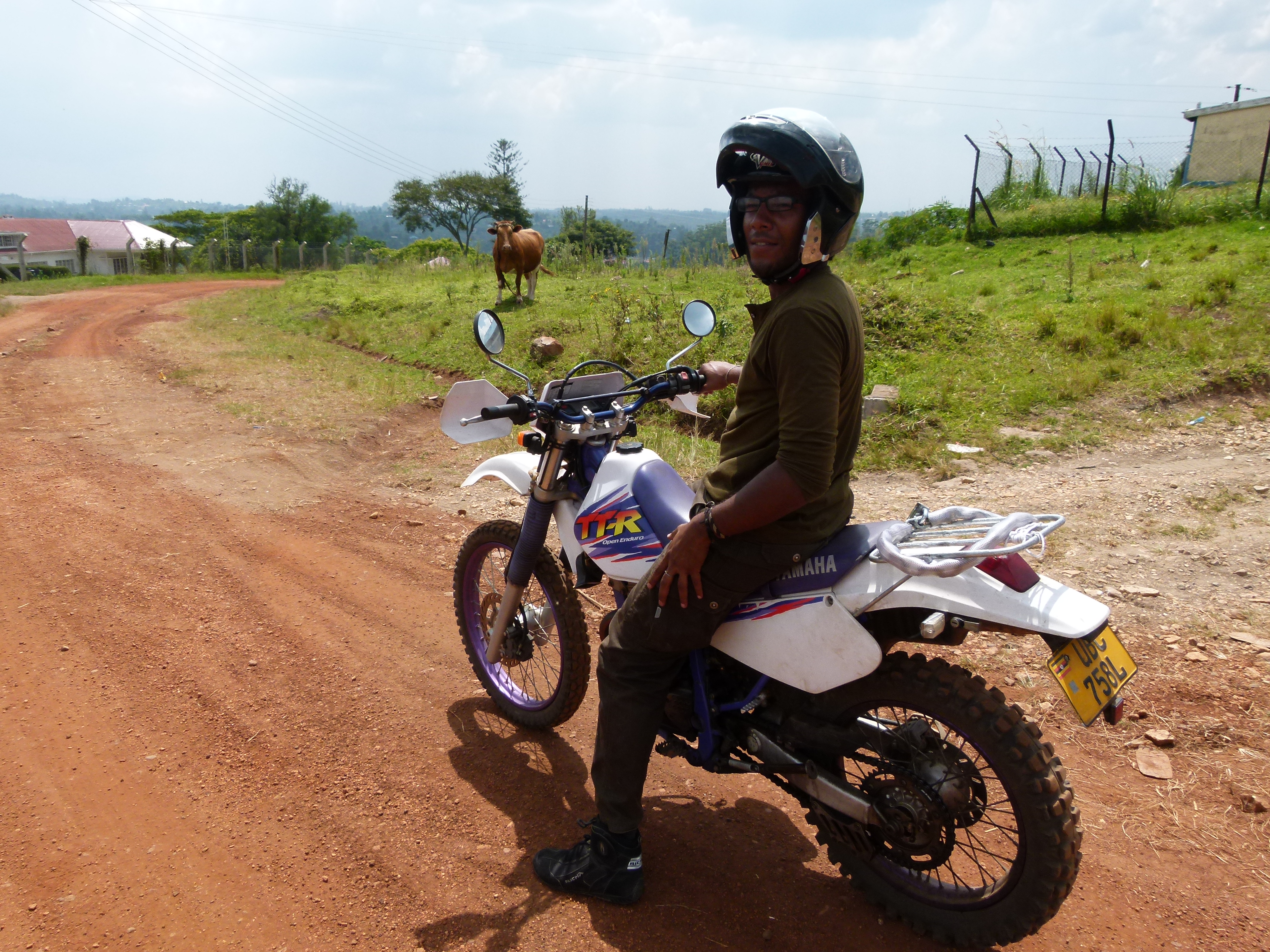 Man on a motorcycle with helmet.
