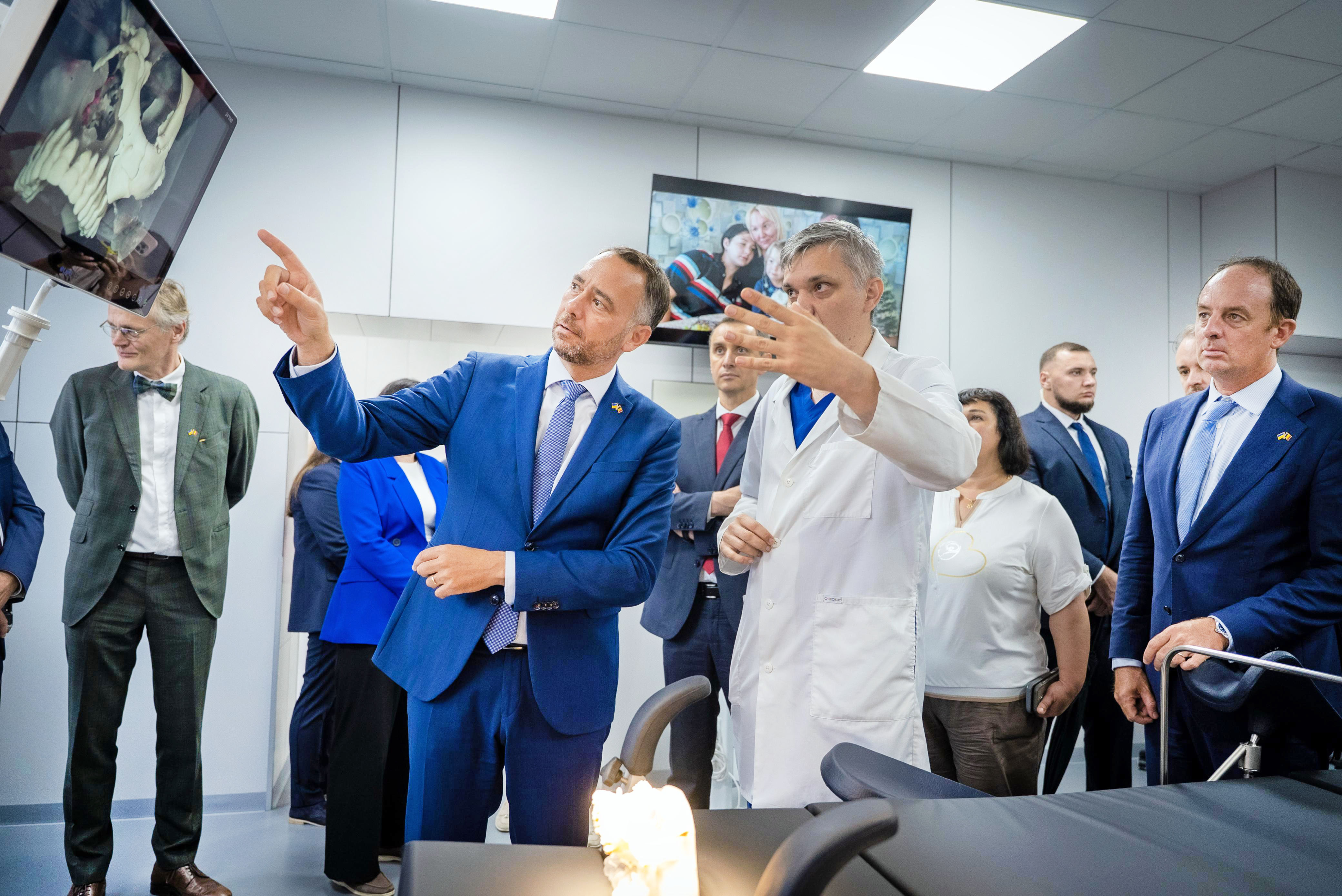 men standing in a hospital radio room