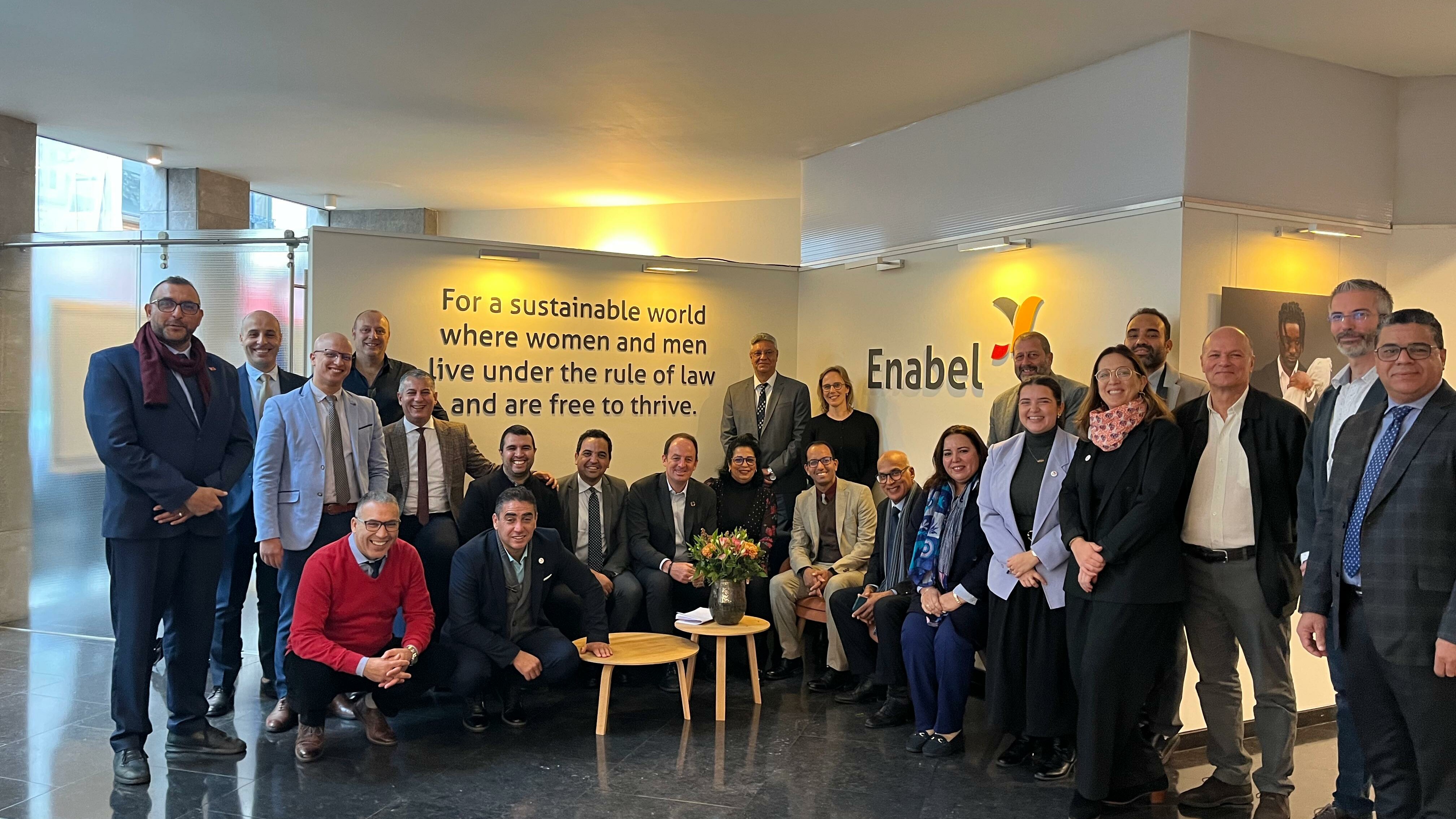 Group picture in the Enabel lobby during an international study visit of partners.