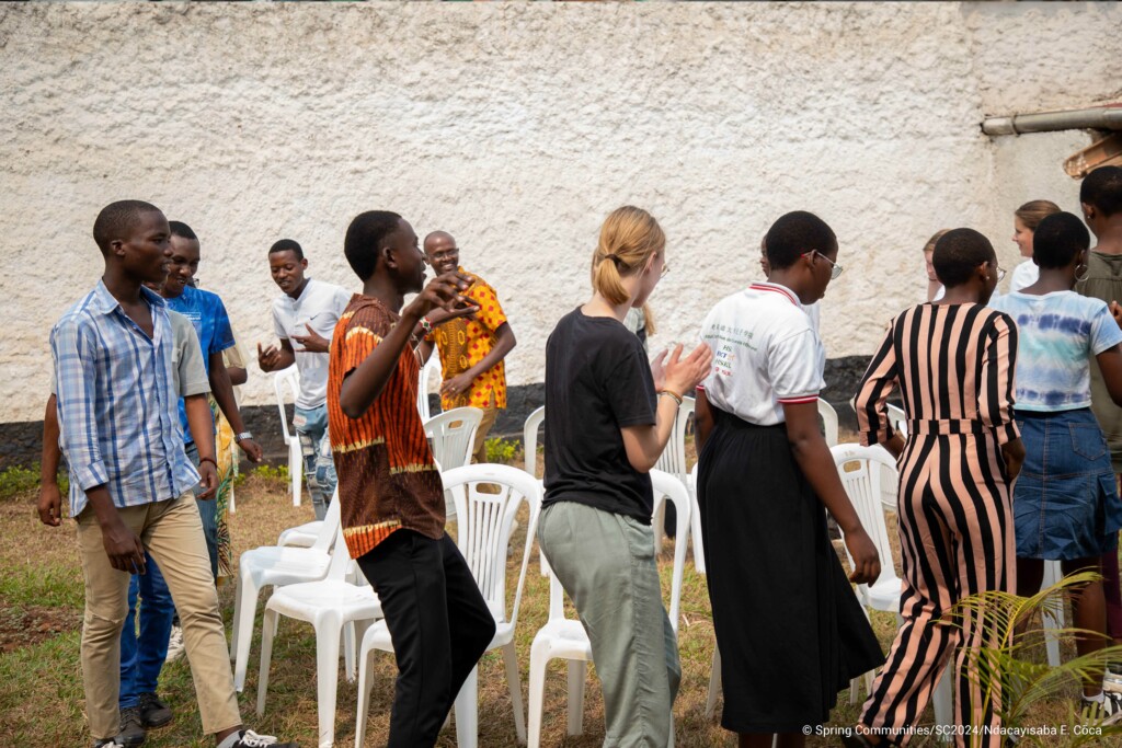 Young people, playing game in a circle