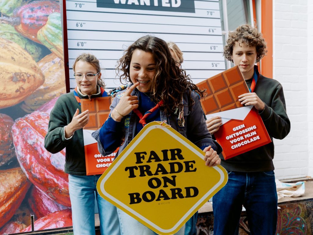 youngsters holding a fairtrade board